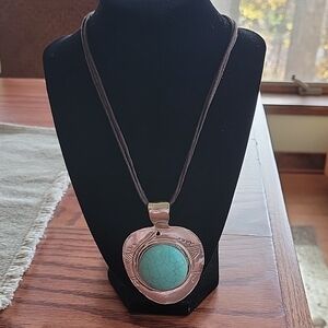16" Turquoise silver necklace by Erica Lyons on a triple brown cord chain.